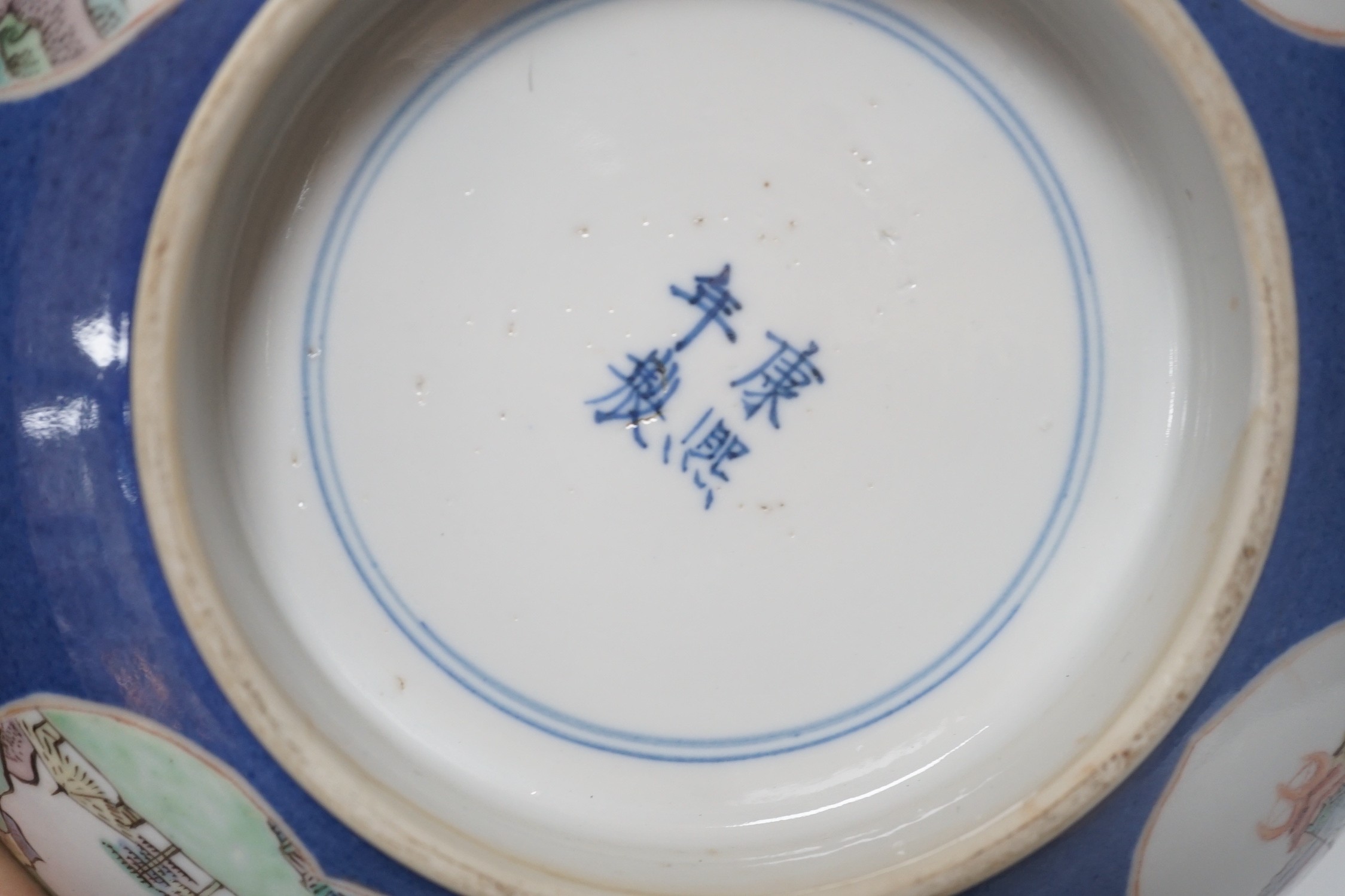 A 19th century Chinese famille verte powder blue bowl, 26cm diameter, wood stand